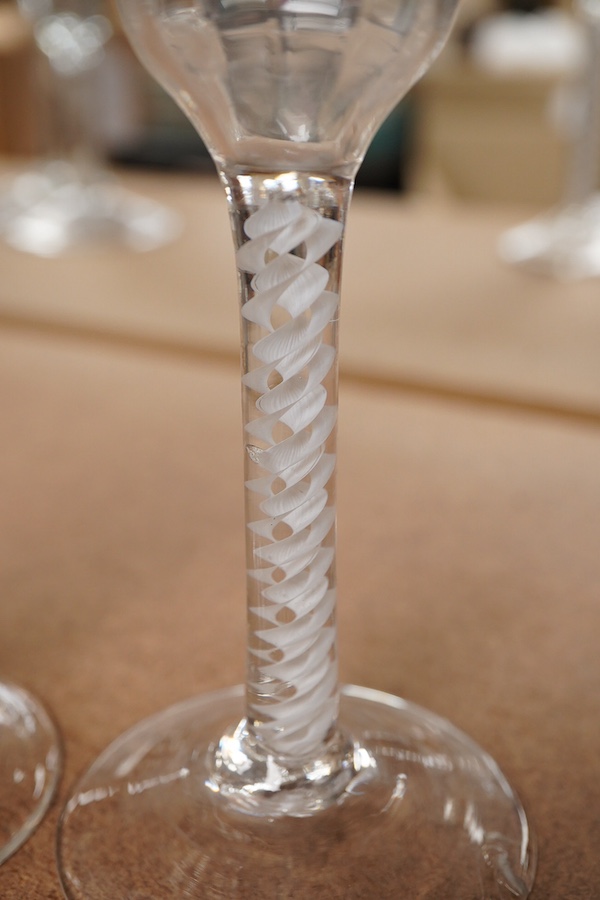 Two 18th century DSOT cordial glasses, one bowl engraved with roses, the other with swag decoration, tallest 16.5cm